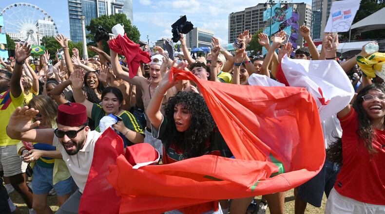 Morocco fans cheer as they gather to watch the match between Morocco vs. Haiti at the FIFA Fan Festival in Centennial Olympic Park on Wednesday, June 24, 2026, in Atlanta. (Hyosub Shin/AJC)