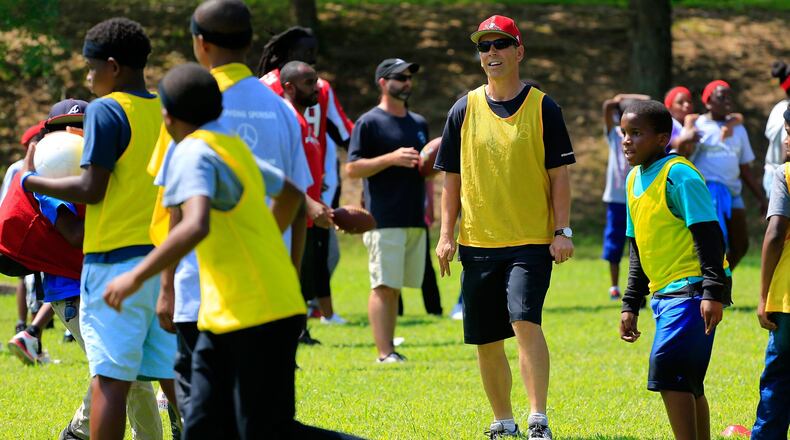 Mercedes-Benz USA CEO Dietmar Exler playing with the kids. CREDIT: Daniel Shirey