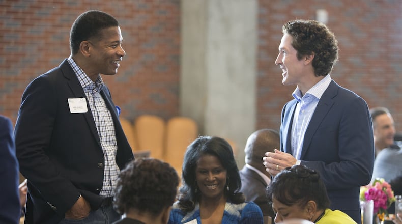 Lee Jenkins (left) of Eagles Nest Church chats with Joel Osteen during the Senior Pastors Atlanta America’s Night of Hope Luncheon at SunTrust Park. (Photo by Phil Skinner)