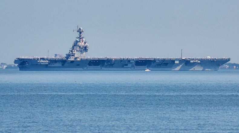 FILE - The USS Gerald R. Ford aircraft carrier leaves Naval Station Norfolk, June 23, 2025, in Norfolk, Va. (AP Photo/John Clark, File)