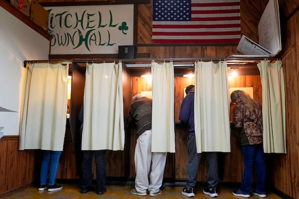 FILE - Voters mark their ballots at a polling place, Nov. 5, 2024, in Mitchell, Wis. (AP Photo/Morry Gash, File)