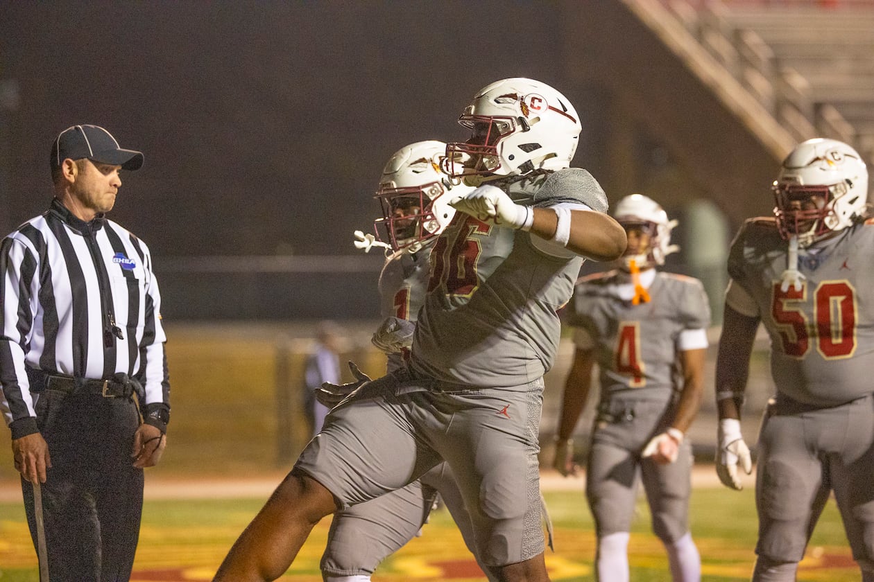 Creekside running back Gary Walker (back) celebrates the game-winning touchdown with teammate Lawrence Martin II during their Class 4A semifinal against Kell on Friday, Dec. 5, 2025, at Creekside High School in Fairburn. (Oscar Guevara Saenz for the AJC)