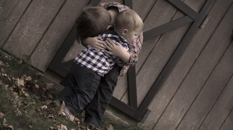 Hugging is one of the main greetings daily for kindergarten students at a northwest Wisconsin school.