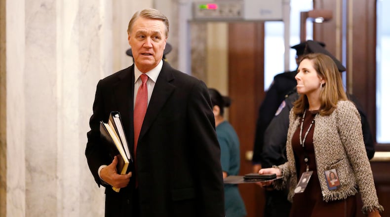 U.S. Sen. David Perdue, a Georgia Republican, arrives at the Capitol in Washington on Jan. 23, 2020. (AP Photo/Julio Cortez)