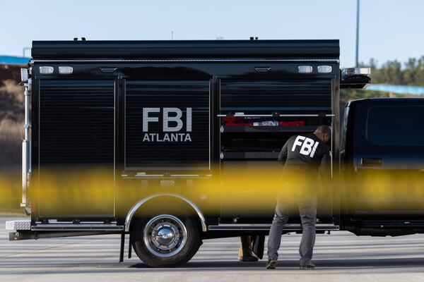 FBI agents conduct a raid at the Fulton County Election Hub and Operation Center in Union City on Wednesday, Jan. 28, 2026. (Arvin Temkar/AJC)