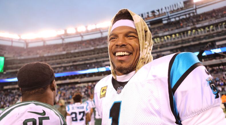 EAST RUTHERFORD, NJ - NOVEMBER 26:  Cam Newton #1 of the Carolina Panthers smiles following the Panthers' 35-27 win against the New York Jets at MetLife Stadium on November 26, 2017 in East Rutherford, New Jersey.  (Photo by Abbie Parr/Getty Images)