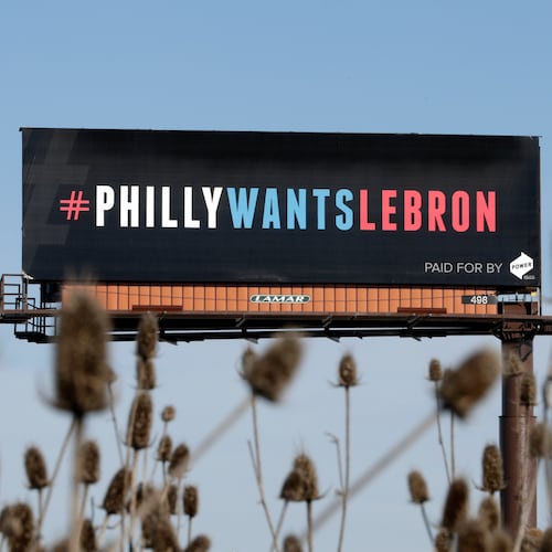 FILE - One of three billboards trying to entice Cleveland Cavaliers' LeBron James to come to Philadelphia are shown near a highway, Tuesday, Feb. 27, 2018, in Cleveland. (AP Photo/Tony Dejak, File)