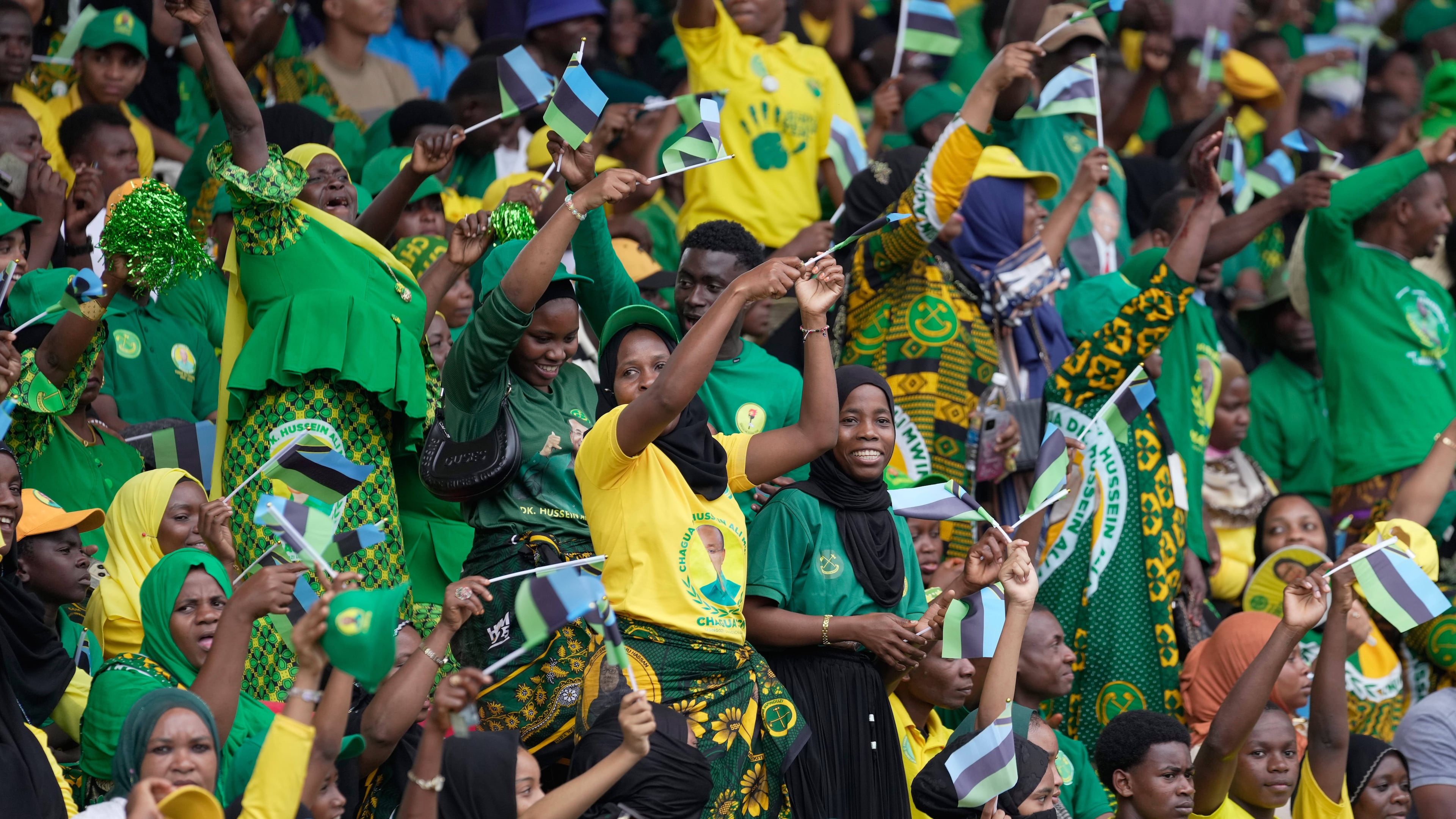 Supporters of the ruling Chama Cha Mapinduzi (Revolutionary Party) sing during the inauguration of Zanzibar President elect Hussein Ali Mwinyi at Amaan Stadium in Zanzibar, Tanzania, Saturday, Nov. 1, 2025. (AP Photo/Brian Inganga)
