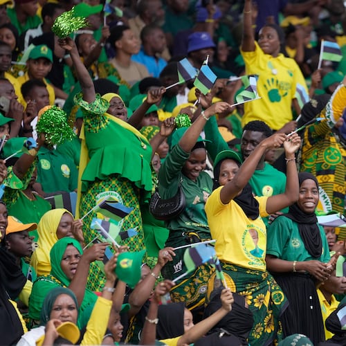 Supporters of the ruling Chama Cha Mapinduzi (Revolutionary Party) sing during the inauguration of Zanzibar President elect Hussein Ali Mwinyi at Amaan Stadium in Zanzibar, Tanzania, Saturday, Nov. 1, 2025. (AP Photo/Brian Inganga)