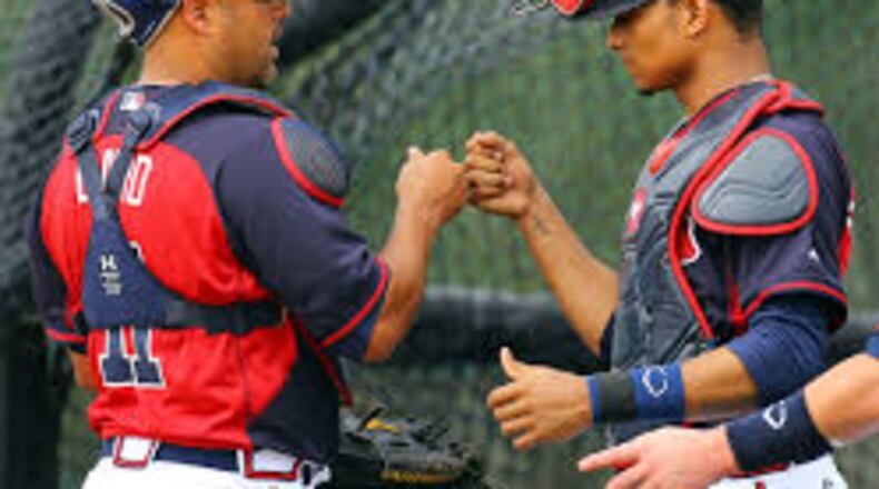 Veteran Gerald Laird (left) believes it's only a matter of time before rookie Christian Bethancourt is good hitter, comparing him to a young Yadier Molina.