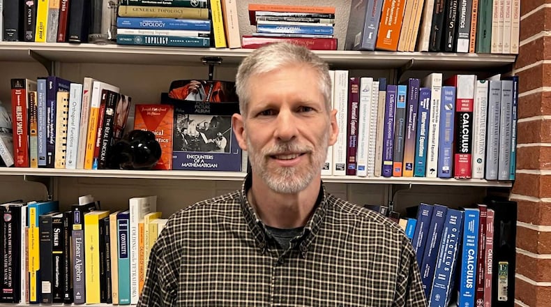 ATLANTA - Georgia Tech associate math professor John McCuan stands in his office after class on Jan. 18, 2022. McCuan criticized efforts by administrators to get students to wear masks in classes and get vaccinated without "critical thinking." His remarks have angered many alumni and current students. (Eric Stirgus/eric.stirgus@ajc.com)