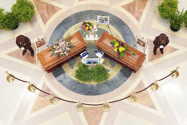 Minnesota State Representative Melissa Hortman, Mark Hortman and their dog, Gilbert, lie in state at the Minnesota State Capital in St. Paul, Minn., on Friday, June 27, 2025. (Alex Kormann/Star Tribune via AP)