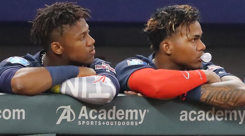 Ronald Acuna (left, with prospect Cristian Pache) could join the Braves outfield as soon as mid-April, and some believe he’s a generational-type talent whose rookie season will be one to remember. Curtis Compton/ccompton@ajc.com