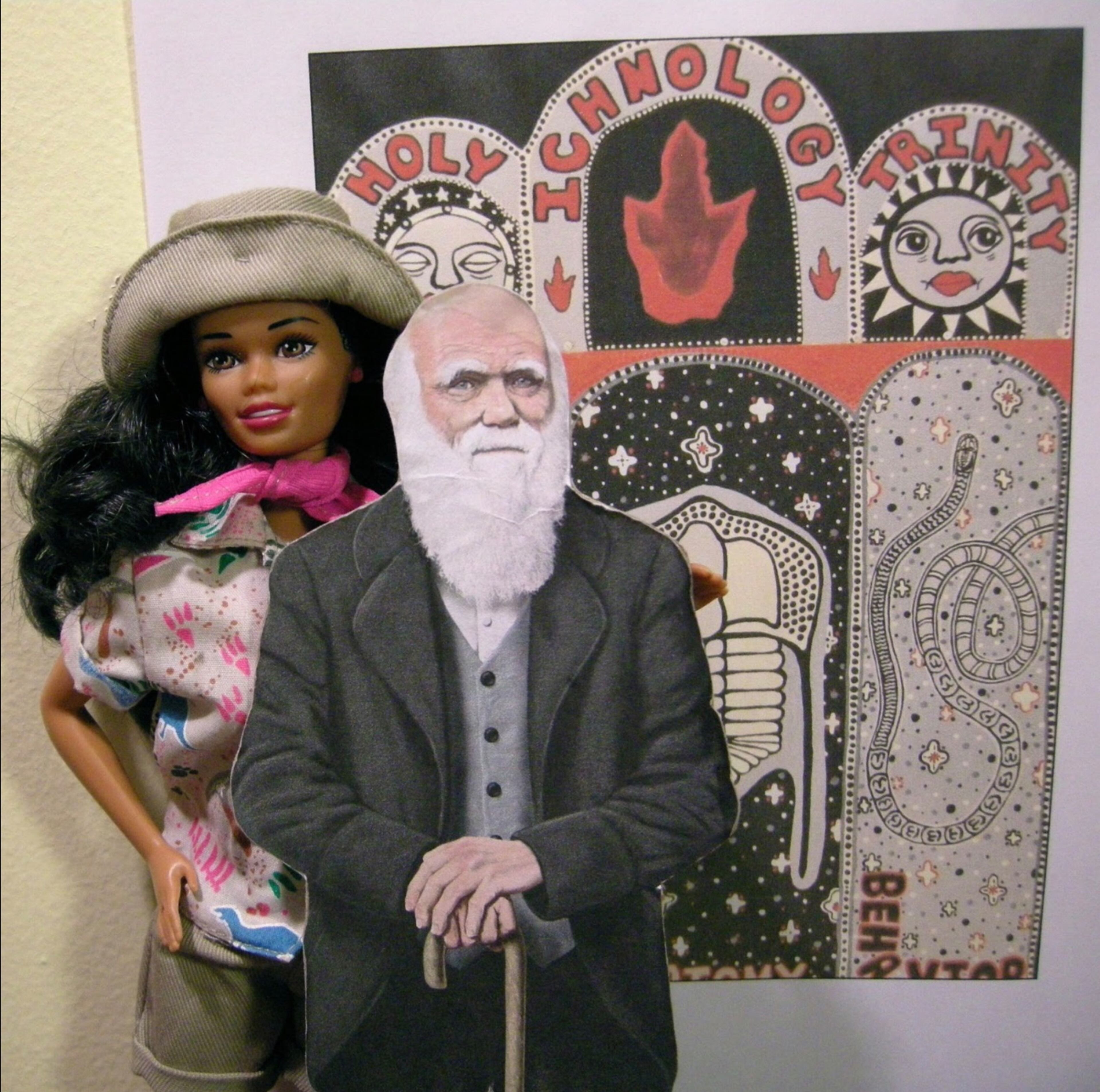 Paleontology Barbie, Charles Darwin and a joint artwork by Schowalter and Martin titled "The Holy Trinity of Ichnology." (Photo cCourtesy of Ruth Schowalter and Tony Martin)