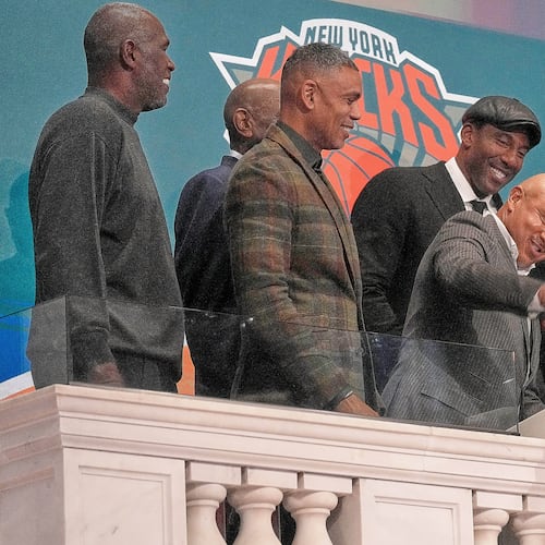 Former New York Knicks John Starks, center, joined by other Knicks Alumni, gavels trading closed at the New York Stock Exchange, Friday, Jan. 16, 2026. (AP Photo/Richard Drew)