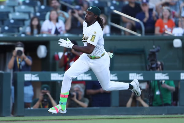 Athletics' Lawrence Butler sprints toward home plate as he hits an inside-the-park home run against the Atlanta Braves during the first inning of a baseball game Tuesday, July 8, 2025, in West Sacramento, Calif. (AP Photo/Scott Marshall)