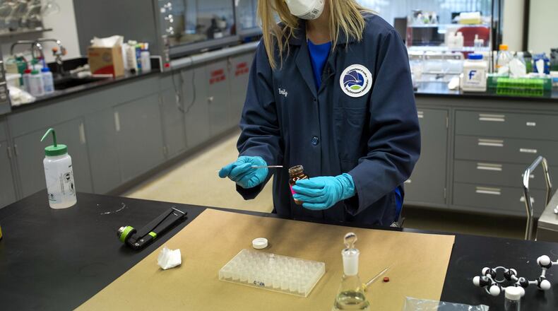 Aug. 9, 2016: U.S. Drug Enforcement Administration Forensic Chemist Emily Dye prepares a control reference sample of fentanyl at the DEA’s Special Testing and Research Laboratory in Sterling, Va. A novel class of deadly drugs is exploding across the country, with many manufactured in China for export around the world. The drugs, synthetic opioids, are fueling the deadliest addiction crisis the U.S. has ever seen. (AP Photo/Cliff Owen)