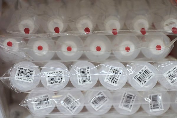 "Made in China" stickers are visible on plastic squeeze bottles typically used for hair dye application, Friday, May 9, 2025, at Besco Beauty International, a beauty products wholesaler in Doraville, Ga. (AP Photo/Stephanie Scarbrough)