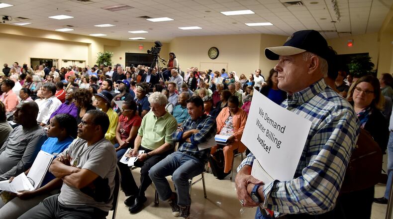 Ernie Duke was one of the hundreds of DeKalb County residents who filled the Maloof Auditorium to a standing room only capacity Thursday night, seeking answers to high water bills. BRANT SANDERLIN/BSANDERLIN@AJC.COM