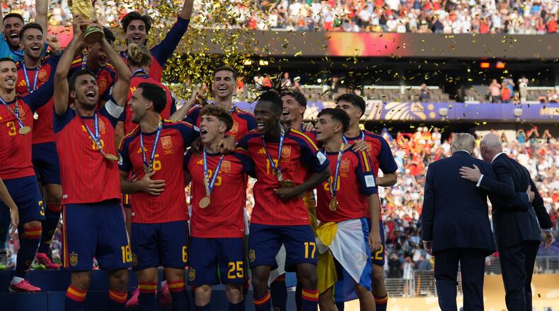 Spain players, from left, cheer alongside President Donald Trump and FIFA President Gianni Infantino at the conclusion of the World Cup championship final soccer match between Spain and Argentina in East Rutherford, N.J., Sunday, July 19, 2026. (AP Photo/Jacquelyn Martin)