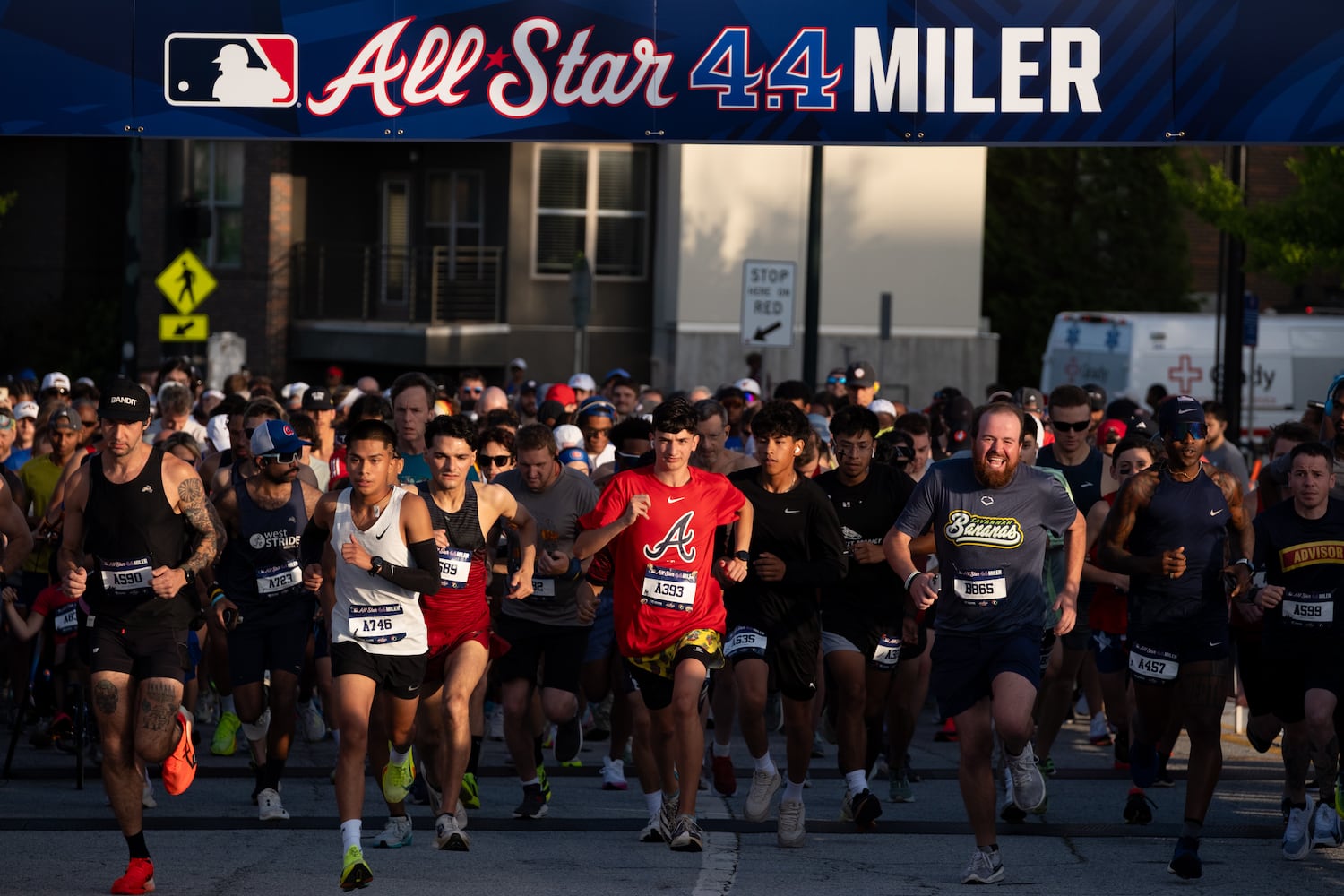 Runners take off at the start of the MLB All-Star 4.4 Miler in Atlanta on Sunday, July 13, 2025.   Ben Gray for the Atlanta Journal-Constitution