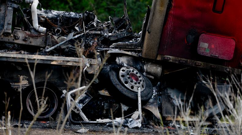 A tractor trailer sits on top of a crushed car after a multiple car accident on I-16 in Pooler, Ga. on Tuesday. Five died in the accident – which occurred less than a month after five Georgia Southern students died, 20 miles away, in an I-16 crash involving a tractor-trailer. AP/Savannah Morning News/Ian Maule