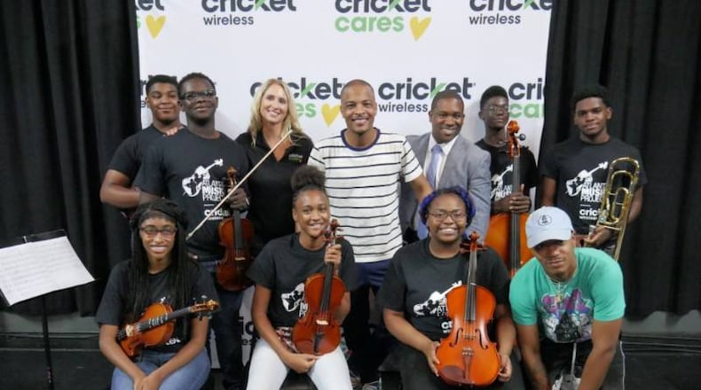 Musicians from the Atlanta Music Project pose with rapper T.I. Photo: Atlanta Public Schools.