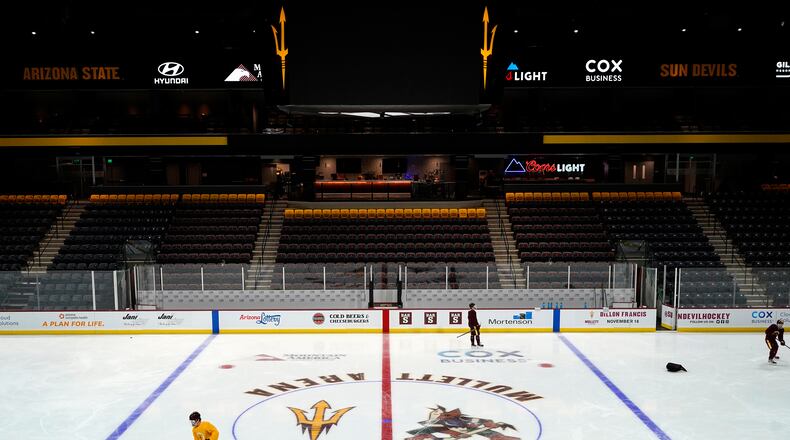 FILE - Members of the Arizona State University hockey team skate on the ice at the new Mullett Arena, Oct. 24, 2022, in Tempe, Ariz. (AP Photo/Ross D. Franklin, File)