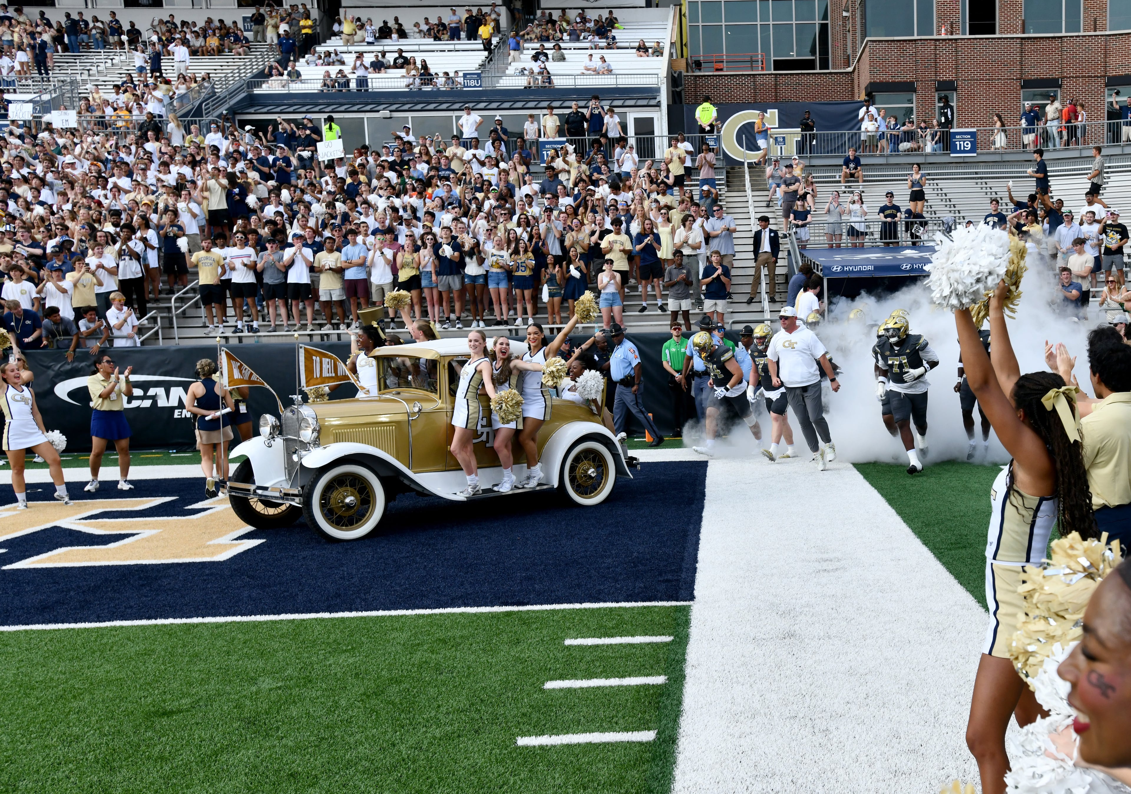 Georgia Tech's Ramblin' Wreck leads the band, cheerleaders, Buzz, players, and coaches before an NCAA college football game between Georgia Tech and Temple at Georgia Tech's Bobby Dodd Stadium, Saturday, Sept. 20, 2025 in Atlanta. (Hyosub Shin/AJC)