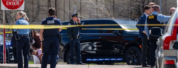 Police work on the scene as a bystander is shook up by the homicide in front of 2107 Cedar Ave S in Minneapolis, Minn., on Wednesday, April 30, 2025. (Richard Tsong-Taatarii/Star Tribune via AP)