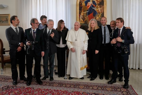In this photo provided by Andrea Pallotti, from left, Associated Press journalists Paolo Santalucia, Gianfranco Styara, Luigi Navarra, Domenico Stinellis, Maria Grazia Murru, Nicole Winfield, Aritz Parra, Paolo Lucariello and Andrew Medichini pose with Pope Francis at the Vatican, on April 24, 2023. (Andrea Pallotti via AP)