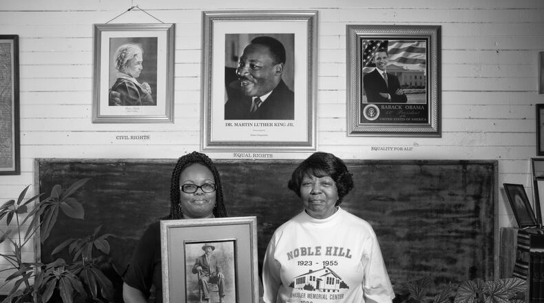 Valerie Coleman (left) and Marian Coleman hold a photo of their ancestor Webster Wheeler, who migrated to Detroit, but returned to Cassville, Ga., to help build the Noble Hill School. That school is now a cultural heritage and community center, curated by Valerie Coleman, great-great-great granddaughter of Wheeler. Valerie's aunt, Marian Coleman, is one of the last graduates of Noble Hill. The two are part of the effort to create a National Park unit dedicated to the Rosenwald schools. Photo: Andrew Feiler