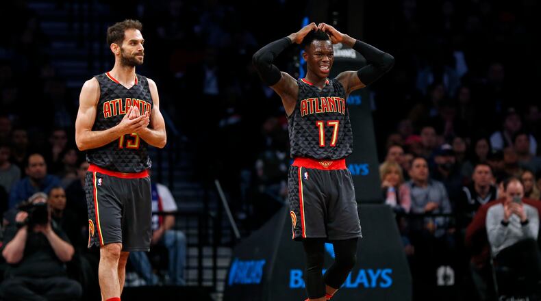 Atlanta Hawks guards Dennis Schroeder (17) and guard Jose Calderon walk back to the bench during the second half of the team’s NBA basketball game against the Brooklyn Nets on Sunday, April 2, 2017, in New York. The Nets won 91-82. (AP Photo/Adam Hunger)