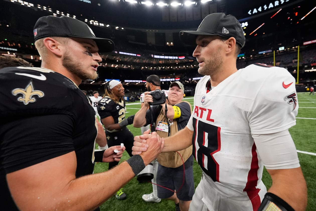 New Orleans Saints quarterback Tyler Shough (6) and Atlanta Falcons quarterback Kirk Cousins (18) shake hands after an NFL football game, Sunday, Nov. 23, 2025, in New Orleans. (AP Photo/Gerald Herbert)