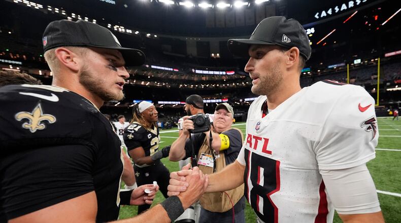 New Orleans Saints quarterback Tyler Shough (6) and Atlanta Falcons quarterback Kirk Cousins (18) shake hands after an NFL football game, Sunday, Nov. 23, 2025, in New Orleans. (AP Photo/Gerald Herbert)