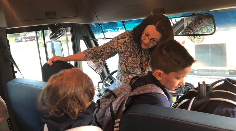 Cobb County Schools bus driver Claudette Petsch drops off students at Sedalia Park Elementary School Thursday morning. (MARLON A. WALKER / marlon.walker@ajc.com)