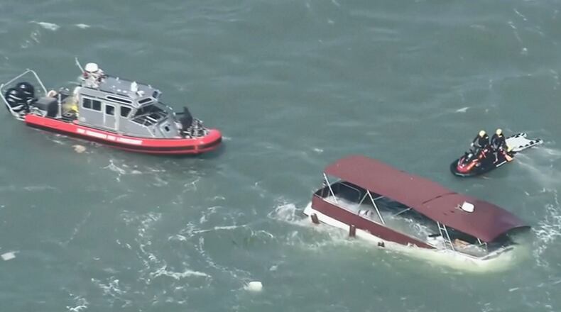 This image made from video provided by KGO-TV shows first responders reacting to a sinking boat Tuesday, July 14, 2026, in the waters off of San Francisco. (KGO via AP)
