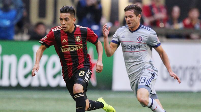 Atlanta United midfielder Ezequiel Barco works past Chicago Fire midfielder Brandt Bronico during the first half in a MLS soccer match on Sunday, Oct 21, 2018, in Atlanta. Curtis Compton/ccompton@ajc.com