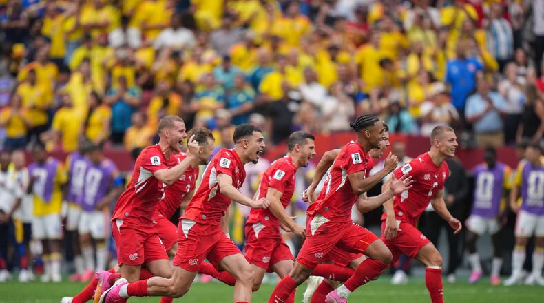 Switzerland players celebrate after defeating Colombia in a penalty shootout in the World Cup round of 16 soccer match between Switzerland and Colombia in Vancouver, British Columbia, Tuesday, July 7, 2026. (Darryl Dyck/The Canadian Press via AP)