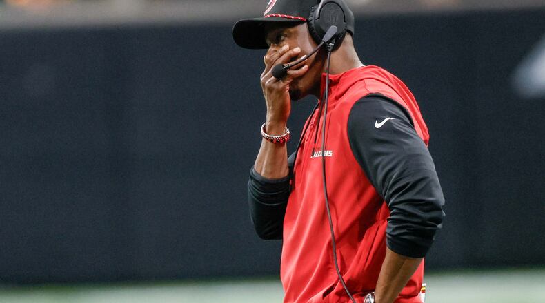 Falcons head coach Raheem Morris reacts after Atlanta Falcons quarterback Kirk Cousins (18) throws an interception during the second half of an NFL football game against the Los Angeles Chargers on Sunday, December 1, 2024, at Mercedes-Benz Stadium in Atlanta. 
(Miguel Martinez/ AJC)