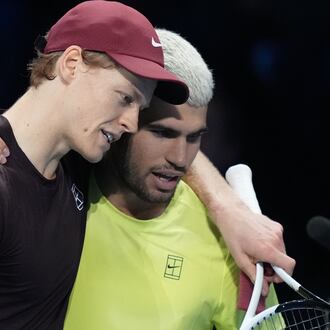 Italy's Jannik Sinner, left, and Spain's Carlos Alcaraz hug after the final tennis match of the ATP World Tour Finals, in Turin, Italy, Sunday, Nov. 16, 2025. (AP Photo/Antonio Calanni)