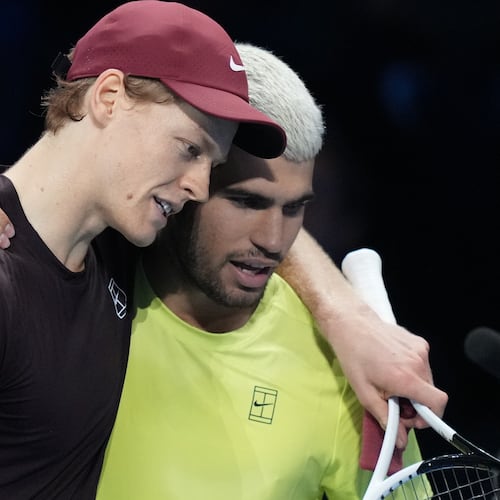 Italy's Jannik Sinner, left, and Spain's Carlos Alcaraz hug after the final tennis match of the ATP World Tour Finals, in Turin, Italy, Sunday, Nov. 16, 2025. (AP Photo/Antonio Calanni)