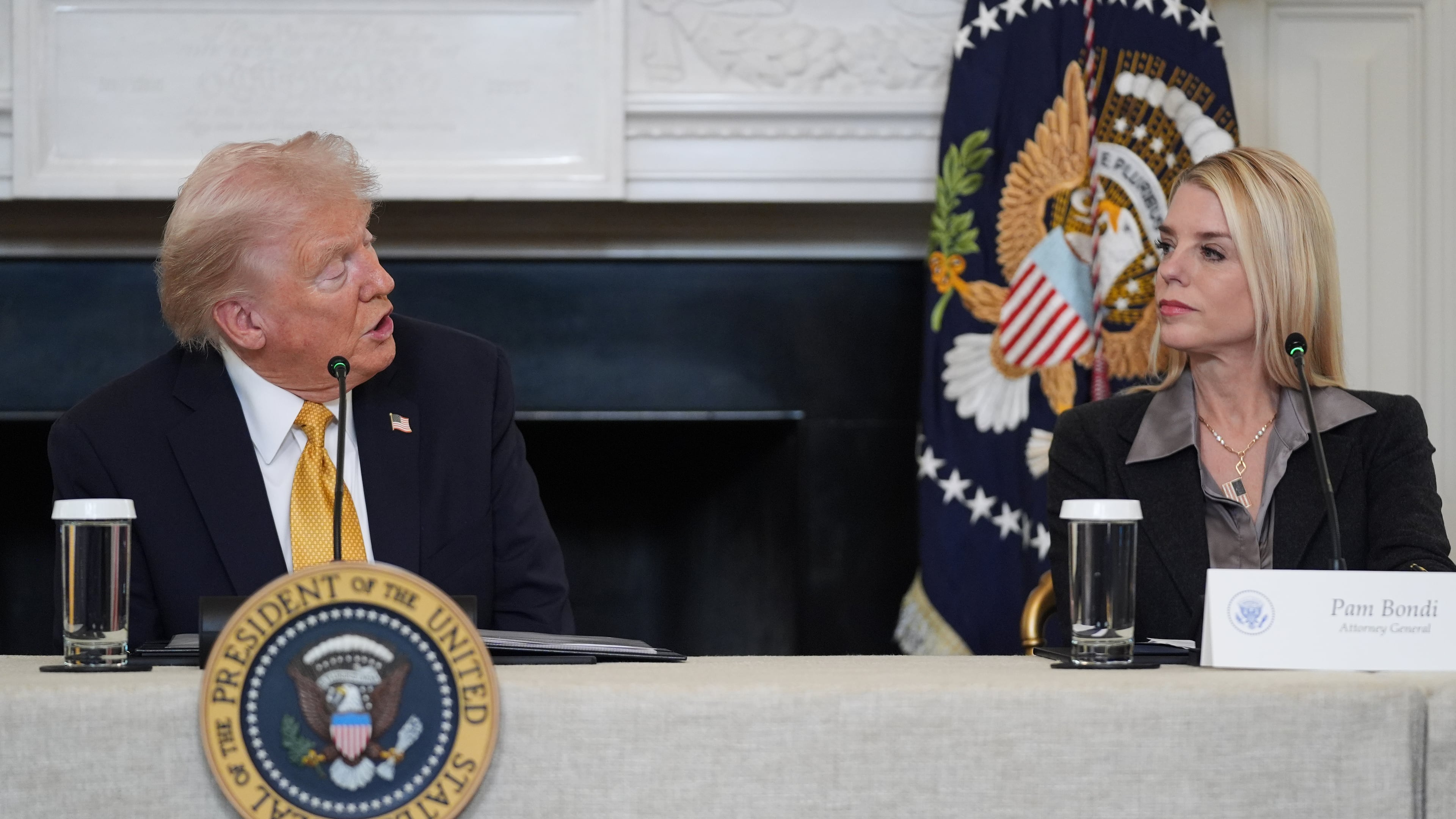 President Donald Trump speaks during a roundtable on criminal cartels in the State Dining Room of the White House, Thursday, Oct. 23, 2025, in Washington, as Attorney General Pam Bondi listens. (AP Photo/Evan Vucci)