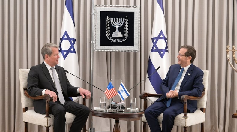 Gov. Brian Kemp, left, discusses foreign policy with Israel President Isaac Herzog, who showed an interest in Georgia's economy. Contributed.