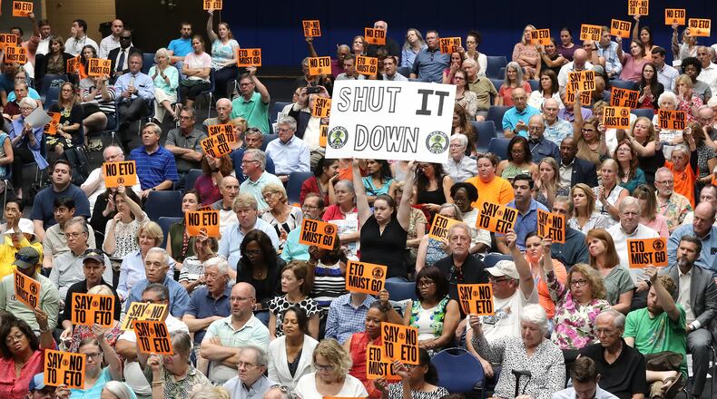 August 19, 2019 Marietta: Hundreds of opponents hold signs in opposition as Cobb officials and environmental regulators hold a town hall and community forum in the wake of reports that Cobb and Fulton have high levels of carcinogenic gas on Monday, August 19, 2019, in Marietta. A user and emitter of the gas, Sterigenics, which sterilizes medical equipment, operates in the area.  Curtis Compton/ccompton@ajc.com