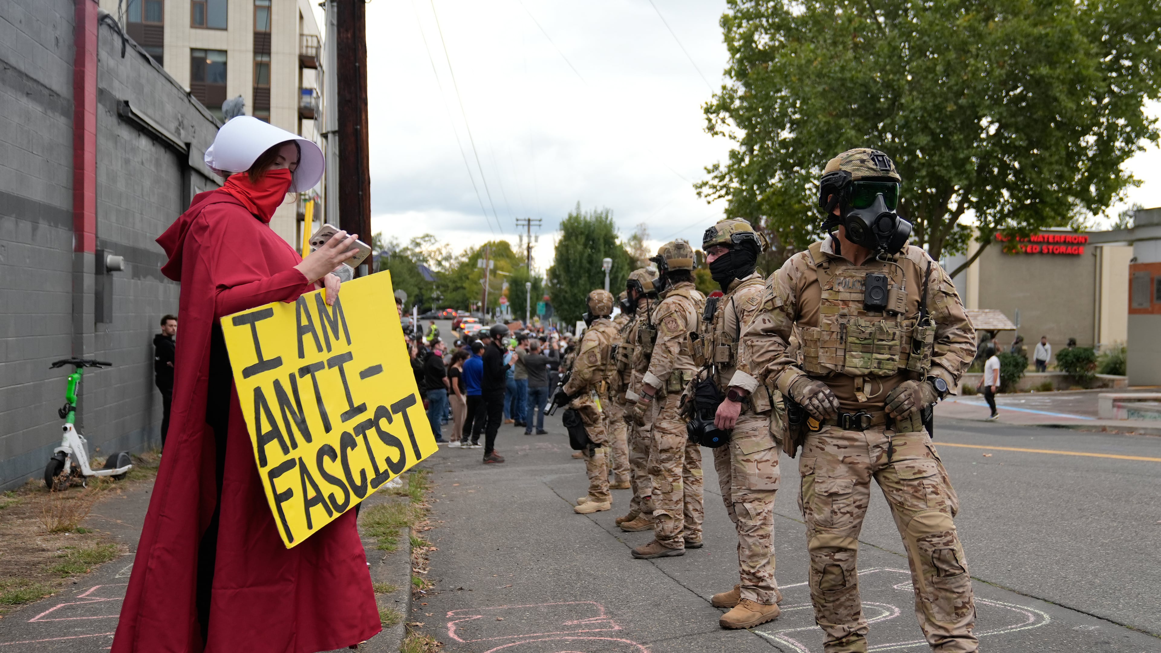Customs and Border Protection agents standoff against demonstrators outside a U.S. Immigration and Customs Enforcement facility during a protest on Saturday, Oct. 4, 2025, in Portland, Ore. (AP Photo/Jenny Kane)