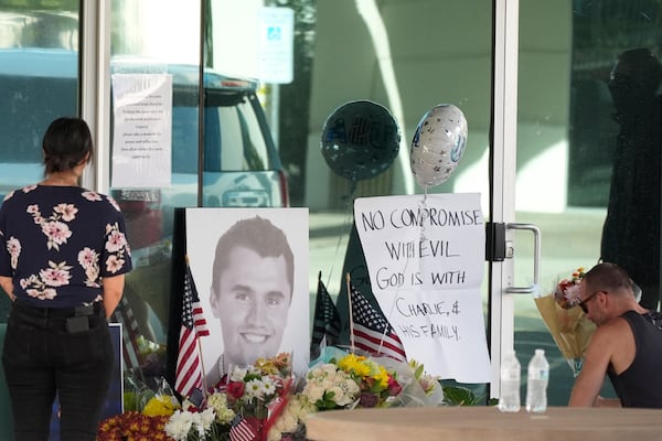 Mourners paid their respects at a makeshift memorial after the shooting death of Charlie Kirk during an event in Utah on Wednesday.