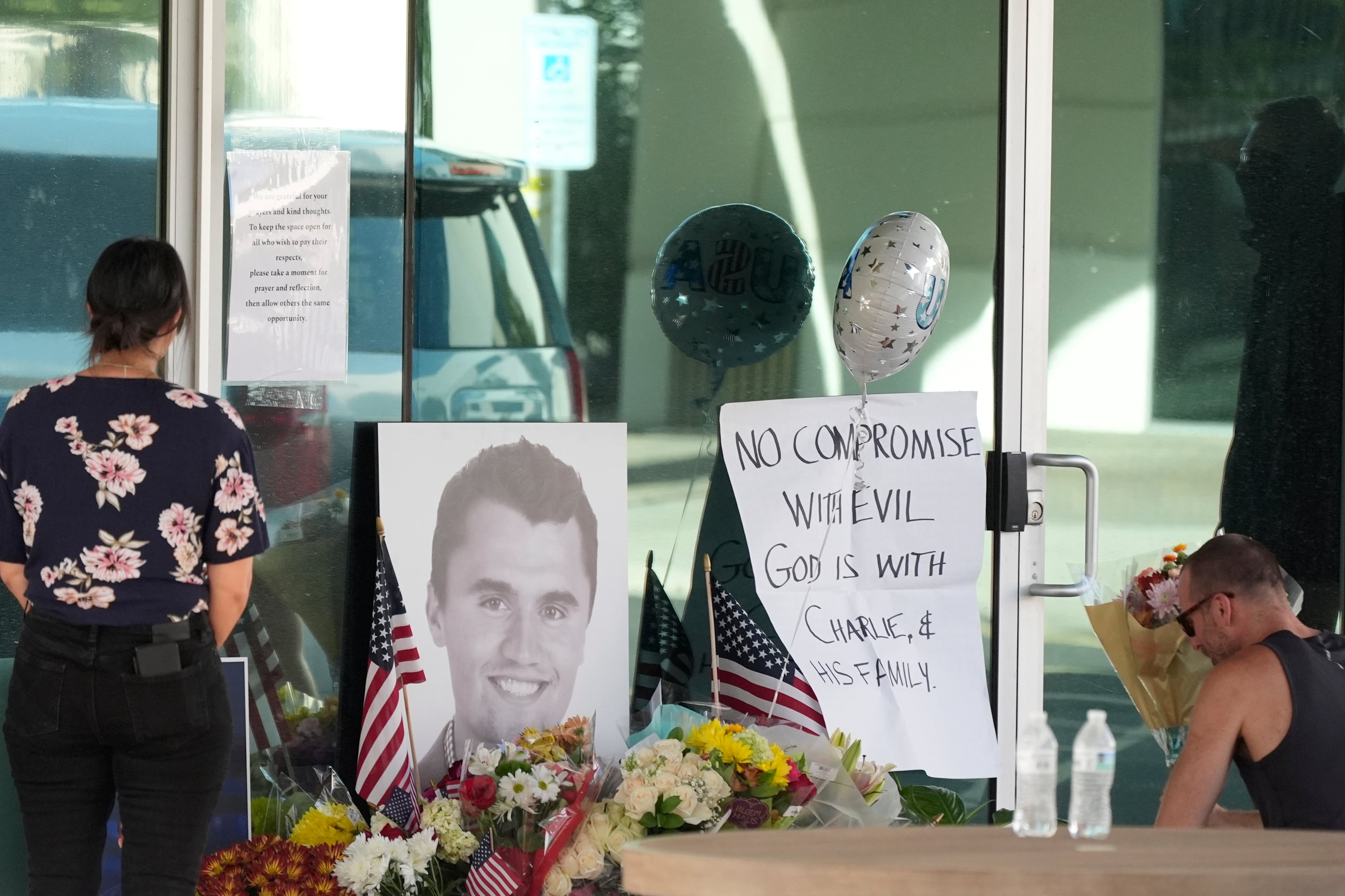 Mourners paid their respects at a makeshift memorial after the shooting death of Charlie Kirk during an event in Utah on Wednesday.