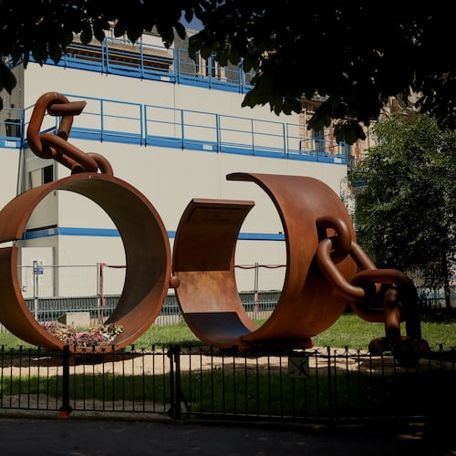 A statue named "Chains," by French artist Driss Sans-Arcidet, honoring the memory of the abolition of slavery, is photographed in a park in Paris, Wednesday, May 27, 2026, as France's National Assembly examines a bill to formally repeal the Code Noir, or Black Code, the 17th-century royal edict that governed slavery in French colonies and treated enslaved people as property. (AP Photo/Thomas Padilla)