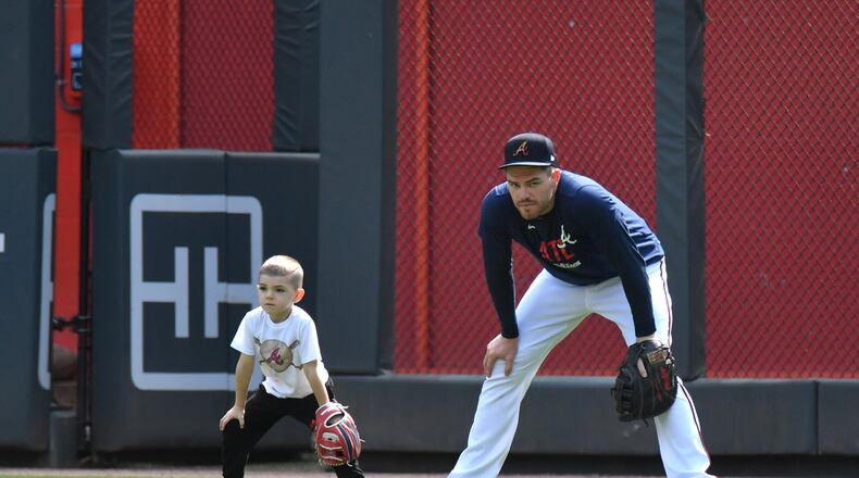 Braves first baseman Freddie Freeman (right) and his son, Charlie, are both free agents.  (Hyosub Shin / Hyosub.Shin@ajc.com)